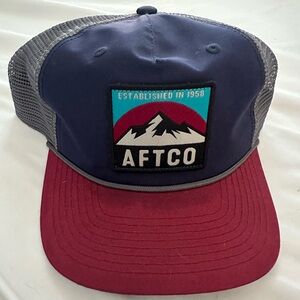 Men Aftco navy hat with burgundy brim. SnapBack with gray . Stain on brim